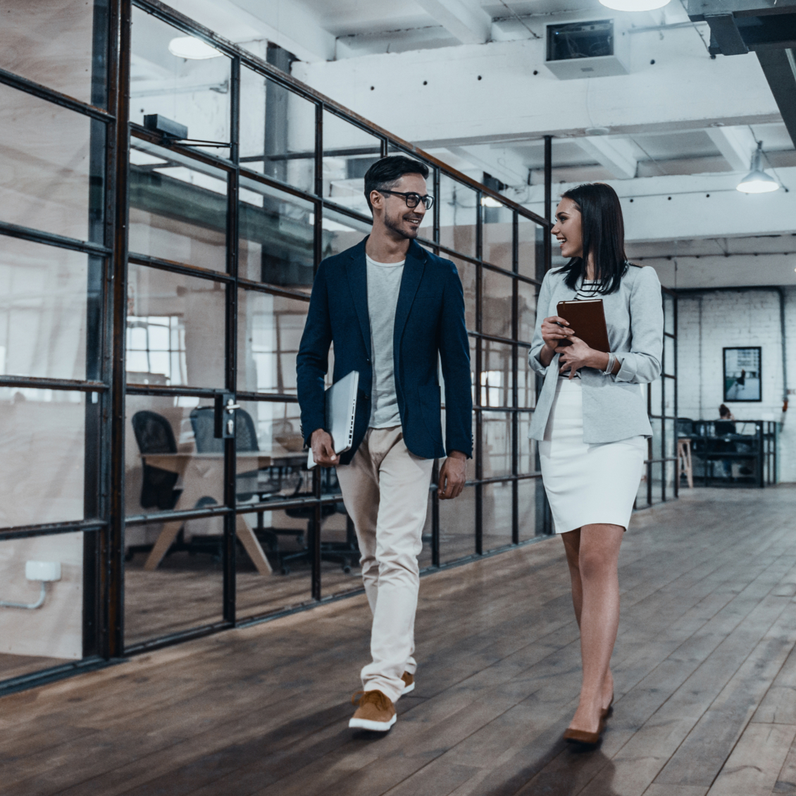 Office staff walking in clean London office Young professionals returning to work in clean London office